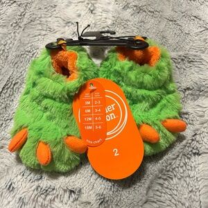 Slippers.  Brand new size 2 kids.  Dinosaur / monster